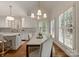 Open-concept kitchen and dining area featuring hardwood floors and lots of natural light at 4301 Fairview Oaks Dr, Charlotte, NC 28211