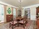 Elegant dining room with hardwood floors, and a large table at 4301 Fairview Oaks Dr, Charlotte, NC 28211