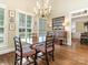 Formal dining room showcasing hardwood floors and a chandelier at 4301 Fairview Oaks Dr, Charlotte, NC 28211