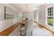 Elegant dining room with ample natural light, stylish furnishings, and hardwood floors at 4301 Fairview Oaks Dr, Charlotte, NC 28211