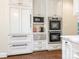 Well-equipped kitchen featuring double ovens and ample cabinetry at 4301 Fairview Oaks Dr, Charlotte, NC 28211