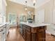 Island kitchen with breakfast area and hardwood floors at 4301 Fairview Oaks Dr, Charlotte, NC 28211