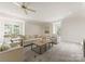 Spacious living room featuring comfortable seating, natural light, and stylish decor, ideal for relaxation and gatherings at 4301 Fairview Oaks Dr, Charlotte, NC 28211