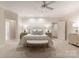 Serene bedroom with neutral tones, soft carpet, and an en-suite bathroom for a relaxing retreat at 4301 Fairview Oaks Dr, Charlotte, NC 28211