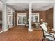Brick screened porch with comfortable wicker furniture at 4301 Fairview Oaks Dr, Charlotte, NC 28211
