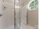 This is a recently renovated shower featuring crisp white walls and bright light at 4301 Fairview Oaks Dr, Charlotte, NC 28211
