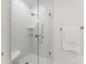 Modern walk-in shower featuring white subway tiles, glass enclosure, and chrome fixtures for a clean, spa-like feel at 4301 Fairview Oaks Dr, Charlotte, NC 28211
