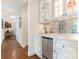 Convenient wet bar with granite countertop and mini-refrigerator at 4301 Fairview Oaks Dr, Charlotte, NC 28211