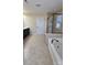 Bathroom featuring a tiled shower and soaking tub adjacent to the vanity and door at 11521 Allen A Brown Rd, Charlotte, NC 28269