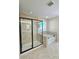 Bright bathroom featuring a tiled shower and a soaking tub by the window at 11521 Allen A Brown Rd, Charlotte, NC 28269