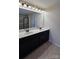 Bright bathroom with dual vanity, quartz counters, and modern light fixtures at 11521 Allen A Brown Rd, Charlotte, NC 28269