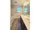 Bathroom featuring a dual vanity, bath tub, and tile flooring at 11521 Allen A Brown Rd, Charlotte, NC 28269