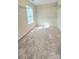 Walk-in closet with carpet, shelves, and window at 11521 Allen A Brown Rd, Charlotte, NC 28269