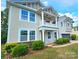 Charming two-story home showcasing a welcoming front porch and manicured landscaping at 11521 Allen A Brown Rd, Charlotte, NC 28269
