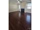 Cozy living area with hardwood floors and an electric fireplace at 11521 Allen A Brown Rd, Charlotte, NC 28269