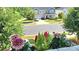 A picturesque street view showcasing a beautiful house and blooming flowers at 11521 Allen A Brown Rd, Charlotte, NC 28269