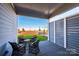 Covered patio with seating area, perfect for outdoor relaxation at 1314 Idyllic Ln, Waxhaw, NC 28173