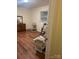 Spacious bedroom with hardwood floors and dresser at 12608 Rocky River Church Rd, Charlotte, NC 28215