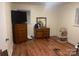 Bedroom with wood floors and dressers at 12608 Rocky River Church Rd, Charlotte, NC 28215