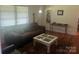 Living room with a brown couch and coffee table at 12608 Rocky River Church Rd, Charlotte, NC 28215