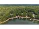 Gorgeous aerial view of lakefront property, showcasing docks and lush green surroundings at 167 Maple View Dr, Troutman, NC 28166