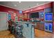 This home bar has a stone facade, seating for three, and an array of shelves with glassware at 167 Maple View Dr, Troutman, NC 28166