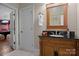 Bathroom featuring a dark wooden vanity with granite countertop and stylish towel hanger at 167 Maple View Dr, Troutman, NC 28166