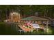 Covered boat dock with a boat and American flag at 167 Maple View Dr, Troutman, NC 28166