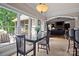 Bright breakfast nook featuring large windows and seamless access to the outdoor deck and living room at 167 Maple View Dr, Troutman, NC 28166