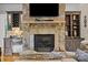 Stone fireplace with a mounted TV and custom built-ins at 167 Maple View Dr, Troutman, NC 28166