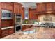 Kitchen details highlighting granite countertops, stainless steel appliances, and custom cabinetry at 167 Maple View Dr, Troutman, NC 28166