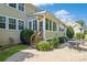 Home features a spacious back patio with seating area and access to a sunroom at 17011 Alydar Commons Ln, Charlotte, NC 28278