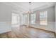 Formal dining room with hardwood floors and natural light at 5027 Mclaughlin Loop # 61, Waxhaw, NC 28173