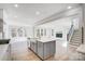 Open concept kitchen with island, looking into living room at 5027 Mclaughlin Loop # 61, Waxhaw, NC 28173