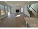 Spacious living room with hardwood floors and fireplace at 5027 Mclaughlin Loop # 61, Waxhaw, NC 28173