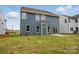 A spacious backyard with lush grass offers a private outdoor retreat for relaxation and entertainment at 8736 Acadia Pkwy # 601, Sherrills Ford, NC 28673