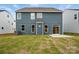 The home's backyard offers a lush green lawn and a patio, ideal for outdoor relaxation and entertainment at 8736 Acadia Pkwy # 601, Sherrills Ford, NC 28673