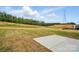 Spacious backyard featuring a concrete patio area with views of surrounding trees and an overhead powerline at 8736 Acadia Pkwy # 601, Sherrills Ford, NC 28673