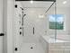 Tiled walk-in shower with glass doors and overhead shower in luxurious bathroom at 8736 Acadia Pkwy # 601, Sherrills Ford, NC 28673