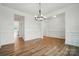Formal dining room featuring wood floors, wainscoting, and chandelier at 8736 Acadia Pkwy # 601, Sherrills Ford, NC 28673