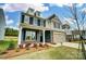 Two-story home featuring a two-car garage, stone accents, and a welcoming front porch at 8736 Acadia Pkwy # 601, Sherrills Ford, NC 28673