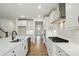 Modern kitchen featuring stainless appliances, white cabinets, and a sleek black faucet at 8736 Acadia Pkwy # 601, Sherrills Ford, NC 28673