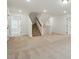 Spacious living room featuring stairs to upper level, recessed lighting, and neutral carpet at 8736 Acadia Pkwy # 601, Sherrills Ford, NC 28673