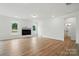 Spacious living room with wood floors, a fireplace, white walls, and abundant natural light at 8736 Acadia Pkwy # 601, Sherrills Ford, NC 28673