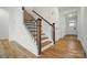 Staircase with wooden railings and hardwood floors at 8736 Acadia Pkwy # 601, Sherrills Ford, NC 28673