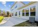 Exterior view of home featuring a patio and natural surroundings at 16004 Deer River Rd, Charlotte, NC 28278