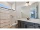 Bathroom with walk-in shower, modern fixtures, and stylish vanity at 16004 Deer River Rd, Charlotte, NC 28278
