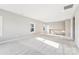 Spacious bonus room with carpet flooring, large windows, and an open staircase at 16004 Deer River Rd, Charlotte, NC 28278