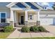 Charming home entrance with stone accents on columns and a well-maintained landscaped front yard at 16004 Deer River Rd, Charlotte, NC 28278