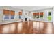 Bright living room with hardwood floors, fireplace, and natural light from many windows at 16004 Deer River Rd, Charlotte, NC 28278